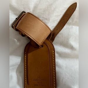 Authentic Louis Vuitton luggage tag. Vachetta leather has a medium Honey Patina.
